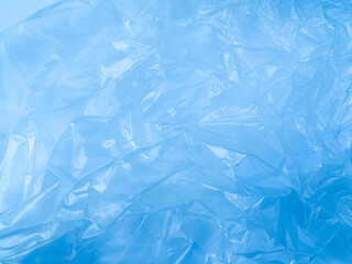 Obraz premium Abstract background plastic bag blue vacuum cling foil wrinkle texture wall crumpled film foil overlay seal wrap polyethyene packaging frame material industry wrinkle template ecosystem environment