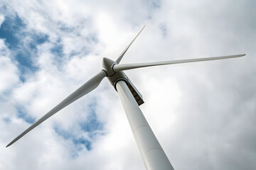 Wind Turbine Against Cloudy Sky &ndash; Renewable Energy Visual