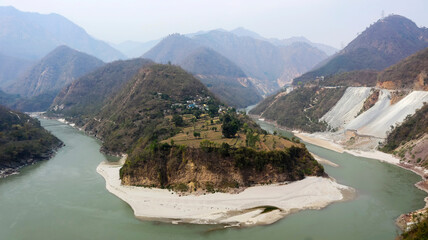 Acute bend of Alaknanda River amidst mountains near Rudraprayag, Uttarakhand, India.