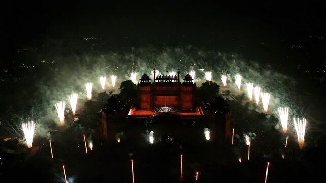 Exploding Fireworks Over Ancient Structure at Night Celebration Event