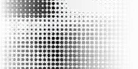 Fototapeta premium Halftone faded gradient texture. Grunge halftone grit background. White and black sand noise wallpaper. Retro pixilated vector backdrop