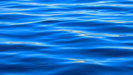 Water, ripples, reflections, texture, light — this close-up macro captures the dynamic play of natural light on aqua blue water, highlighting concentric ripples, shimmering hues, and subtle tonal tran
