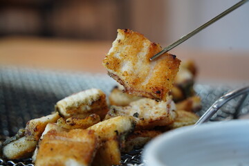 Grilled Eel Pieces in Metal Basket