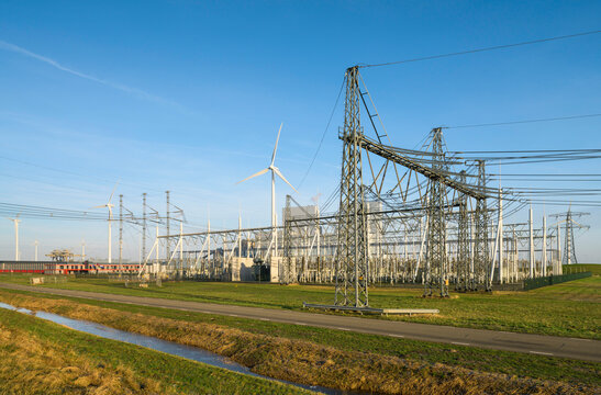 Wind turbines near power lines and transformator substation