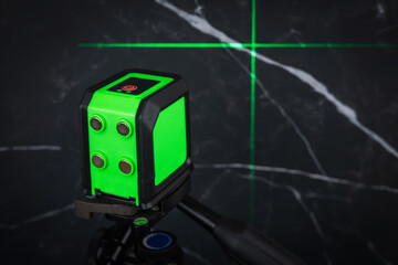 Construction laser level in a building under construction. Laser equipment at a construction site