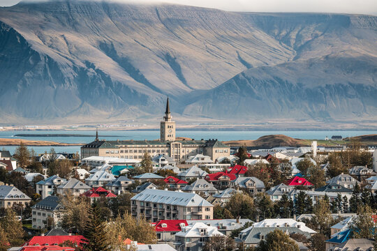Cityscape of downtown Reykjav&iacute;k in Iceland, featuring colourful houses, T&aelig;knisk&oacute;linn college and mountain Esjan in the background