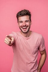 Fototapeta premium Laughing Confident Man Pointing at Camera in Studio Portrait