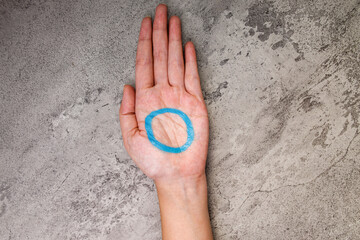Top View Of Woman Hand Showing Blue Circle For Diabetes Awareness And Support
