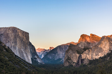 Half Dome illuminated as the sun sets over Yosemite Valley
