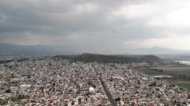 frontal drone shot of urban poverty and street market in mexico city