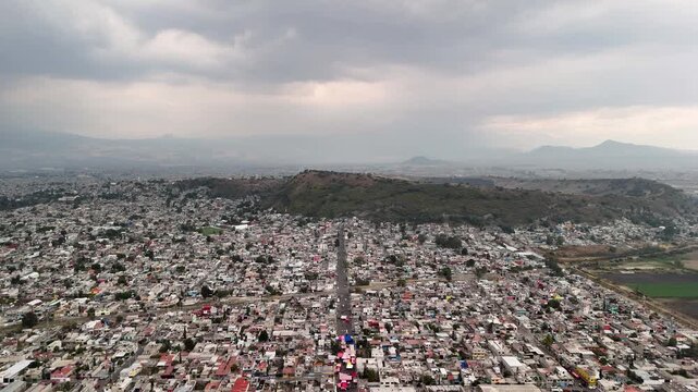 backwards drone shot of urban poverty in chalco estado de mexico