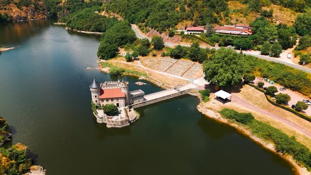 aerial shot above the Chateau de la roche revealing the Loire river and the landscape behing near Roanne in Loire departement, Auvergne Rhone Alpes region, France