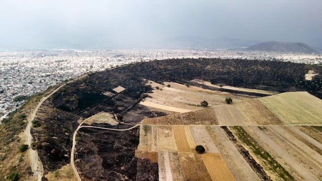 bakwards shot of a fire at the volcano crater in chalco mexico