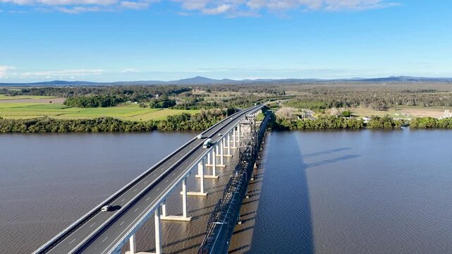 Australia&rsquo;s Clarence River sparkles beneath Harwood Bridge in vibrant drone footage.