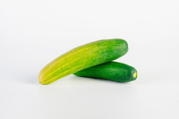 Fresh cucumbers on white background.