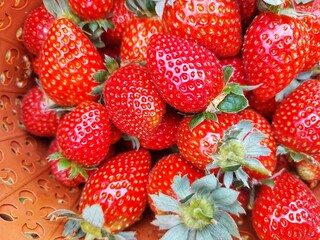 Close-up of a basket full of fresh red strawberries