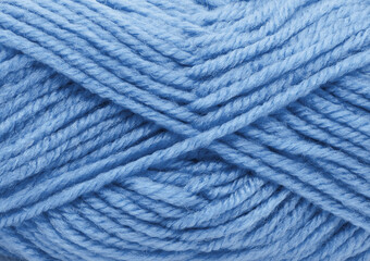 A close up of a blue yarn with a fuzzy texture