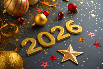 Colorful New Year's celebration decorations with golden numbers for 2026 on a blue background