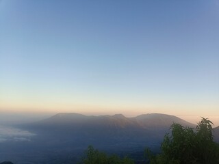 Golden Hour Landscape with Mountain Silhouettes