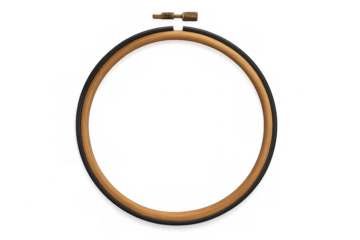 Circular wooden embroidery hoop with metal screw, isolated on a transparent background, ideal for craft and sewing projects