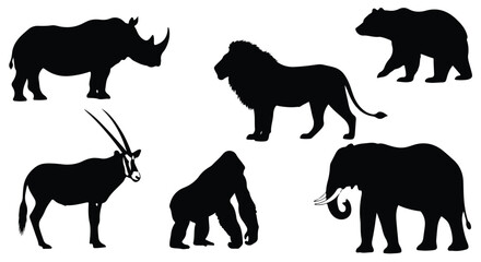 Fototapeta premium Vector silhouette illustration a collection of african wildlife silhouettes including a lion, gorilla, elephant, and rhinoceros
