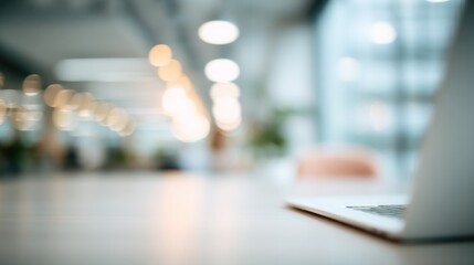 Blurred Background Of Modern Office Workspace With Laptop, Ideal For Website Background Or Corporate Presentation