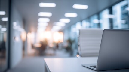Laptop on Desk in Modern Office with Blurred Background