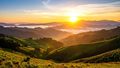 Sunrise over rolling hills and valleys, mist clinging to lower slopes
