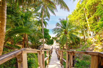 Amazing travel view Phuket, Thailand. Famous touristic place Naithon beach wooden bridge