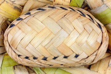 Close-up of a woven, light brown basketry object