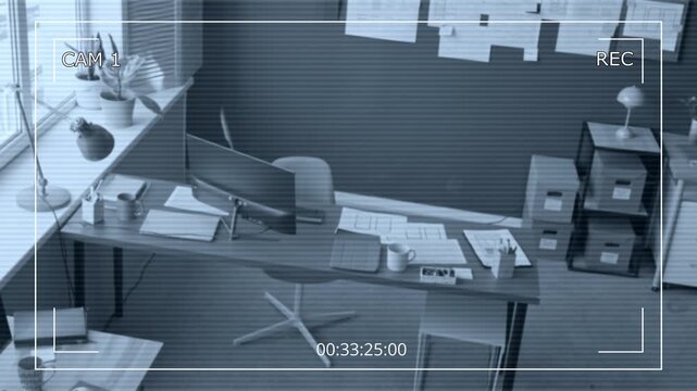 Security camera footage of UX designers office equipped with computers on desks displaying UI of mobile app on screens