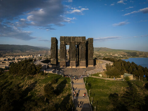 Aerial view of the Chronicles of Georgia monument rising majestically against the skyline, a monolithic testament to history, Tbilisi, Tbilisi, Georgia.