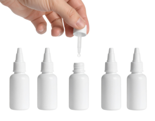 A hand holds the dropper cap above an open white plastic bottle, surrounded by four closed white plastic bottles arranged in a row.