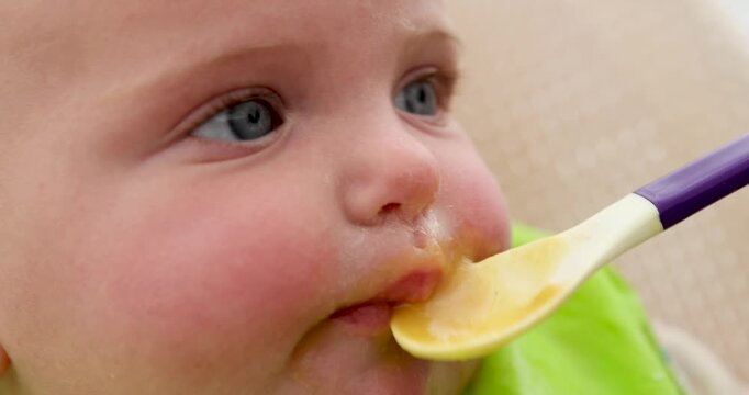 Close-up shots capture an adorable baby with messy cheeks and a bib, eagerly enjoying a meal of puree, showcasing the joys and challenges of baby-led weaning