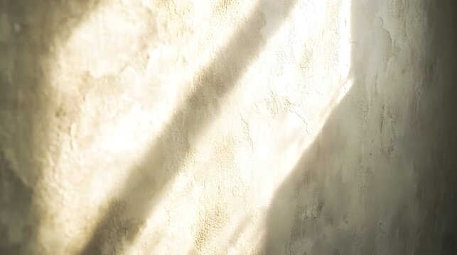 Photograph of a textured wall dominated by strong, parallel light and shadow patterns.
