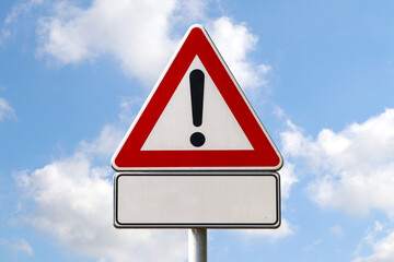 Warning road sign with exclamation mark and an empty space to insert text.