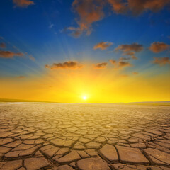 dry cracked earth in light of evening sun
