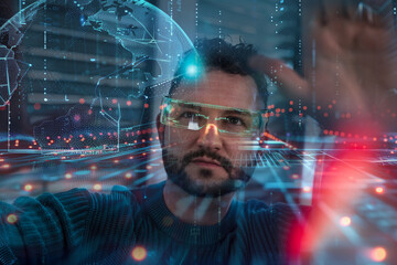 Businessman wearing smart glasses and examining data