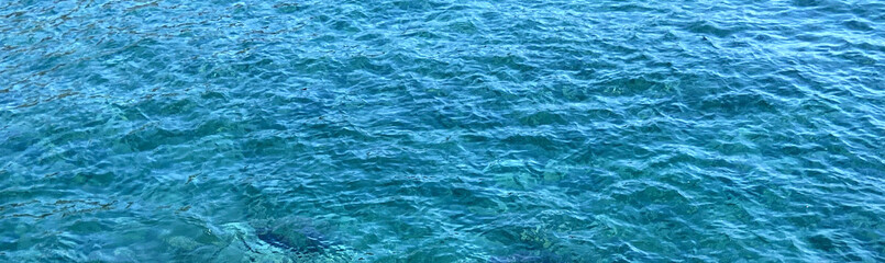 Abstract blue ocean water background.Sea waves natural texture.Banner with space for text.Selective focus.
