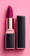 Close-up of a lipstick, berry shade in a black and rose-gold case, lying on its side with the cap removed, revealing its color, all against a pastel pink background