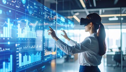 Female professional wearing virtual reality headset interacts with digital data displays, analyzing graphs and charts in a modern office environment, showcasing technology and innovation in data 