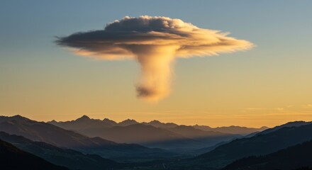 Spectacular lenticular cloud formation over alpine landscape at golden hour radiance