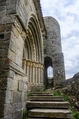 Romanesque entrance and tower of Hermitage of Santa Cecilia in Villaespinoso de Aguilar