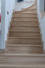 Fototapeta premium Wooden Staircase with Smooth Steps and Neutral Tones