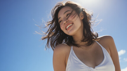 Naklejka premium Smiling Japanese woman in white top on tropical beach 