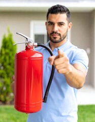 A man holding a fire extinguisher