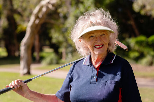 smiling senior woman at golf