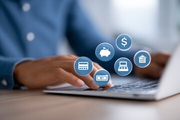 Hands on laptop, financial icons overlay