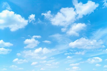 Obraz premium Clear Blue Sky with Fluffy White Clouds for Natural Backgrounds and Copy Space