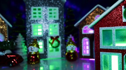 Decorated Christmas village with colorful houses and snowmen